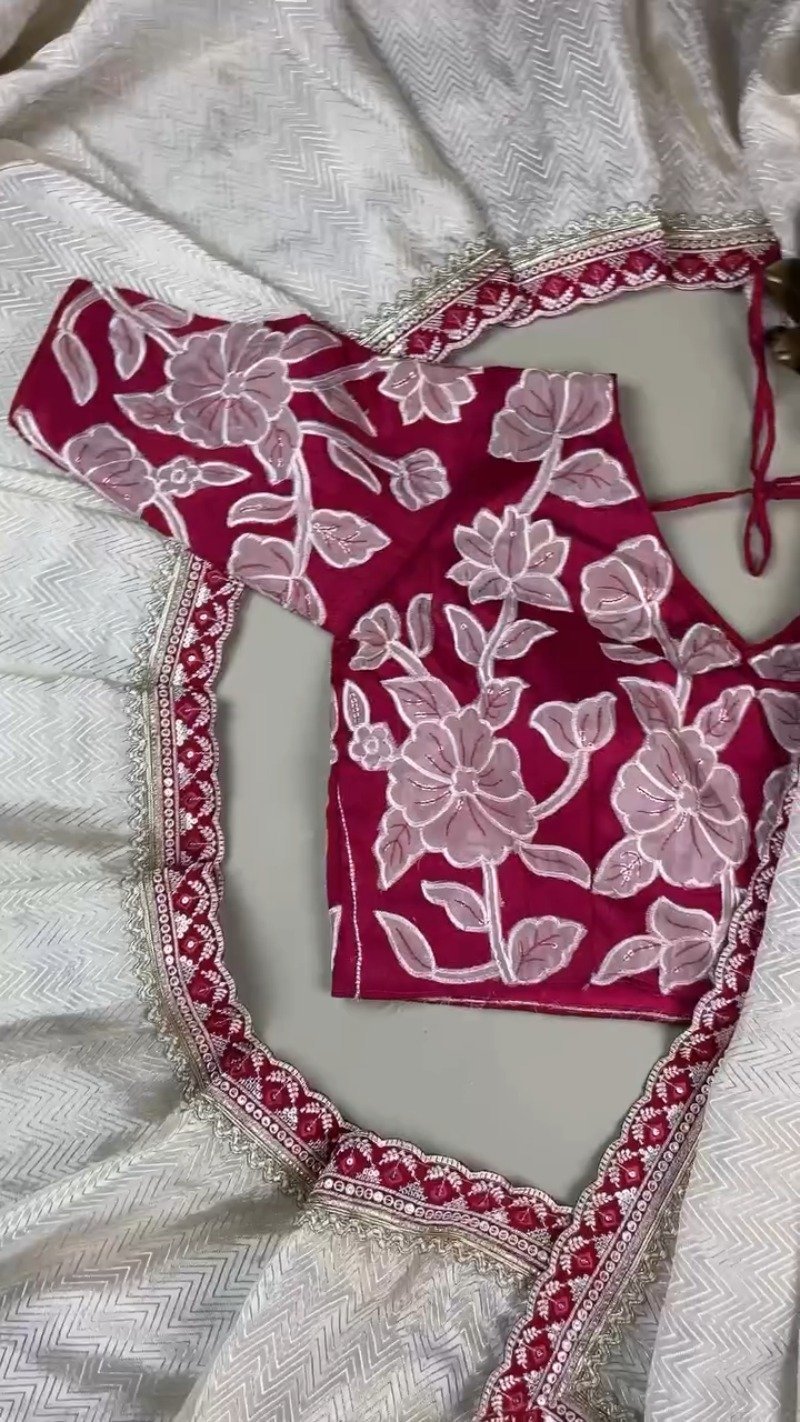 Ivory Chevron Pattern Saree with Embellished Deep Magenta Blouse – Elegant Festive Drape
