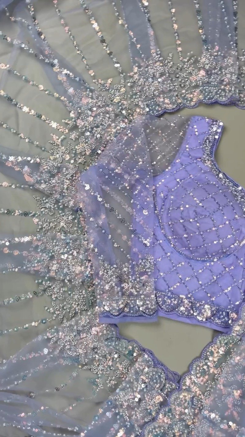Enchanting Lavender Sequined Net Saree with Intricate Diamond-Grid Blouse